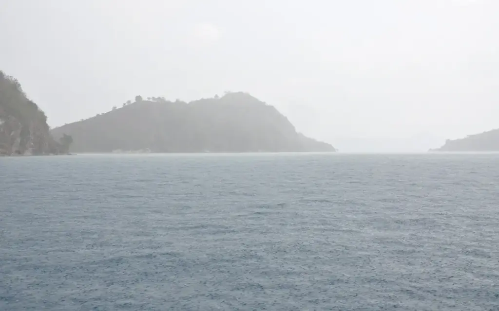 Heavy rain over the sea during a boat crossing back to Labuan Bajo.
